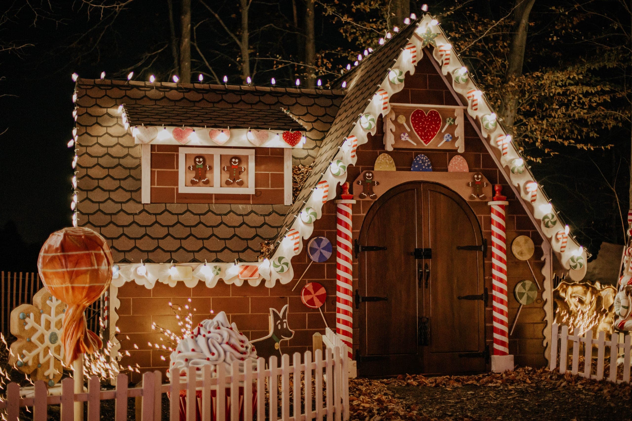 The gingerbread house lit up at night